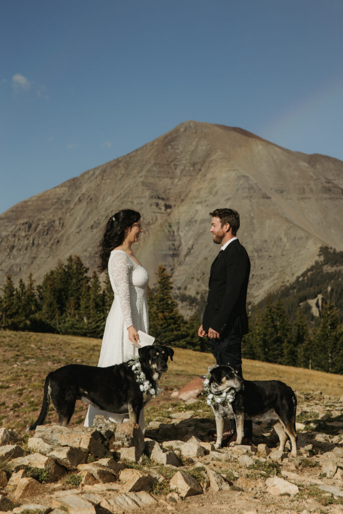 Couple gets ready to read their wedding vows in the Colorado mountains.